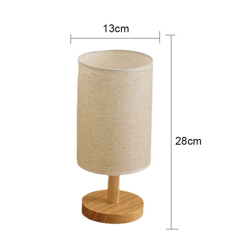 Schéma des dimensions de la lampe de chevet en bois avec abat-jour cylindrique crème indiquant une hauteur de 28cm et une largeur de 13cm