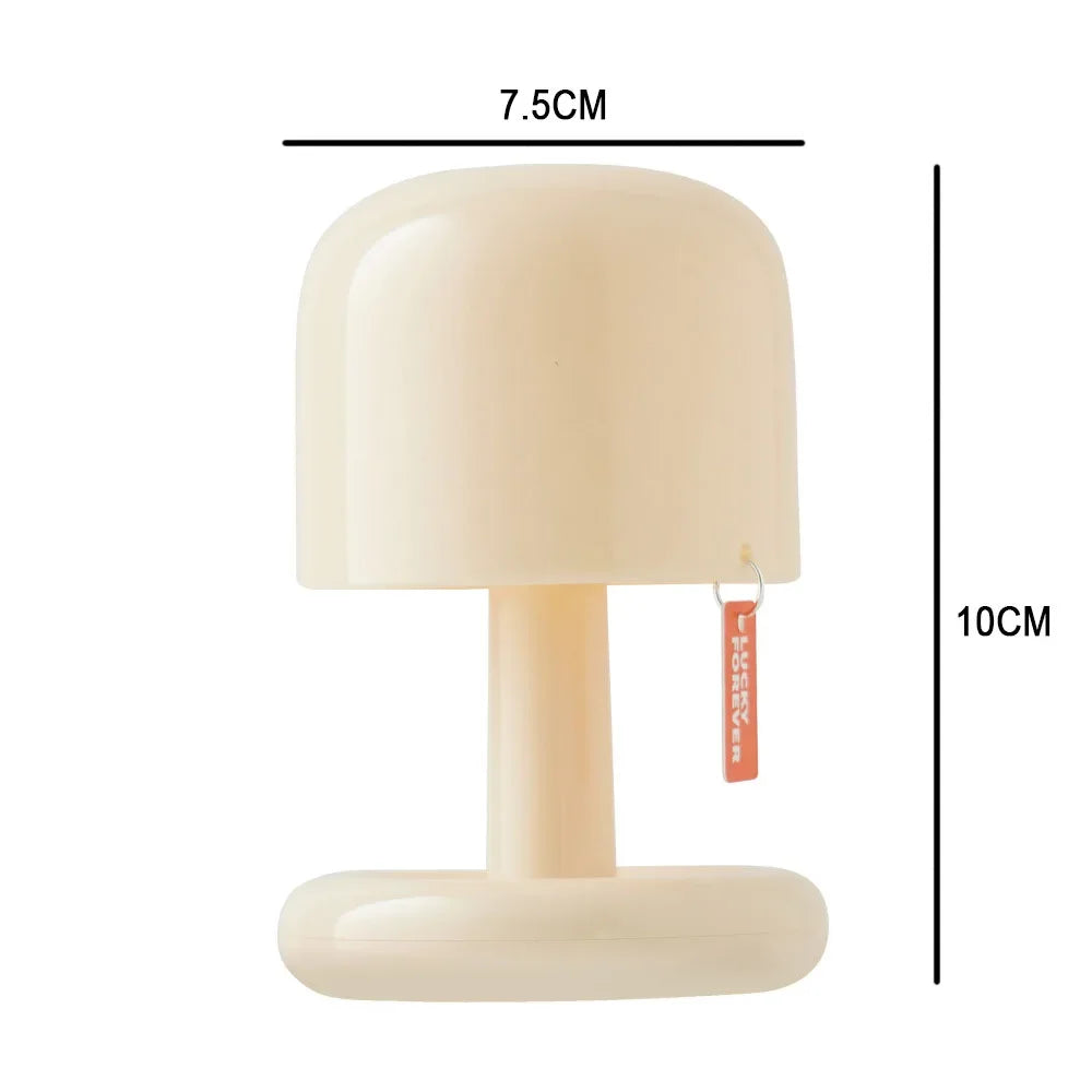 Schéma des dimensions de la lampe de chevet nomade beige indiquant une hauteur de 10cm et une largeur de 7.5cm