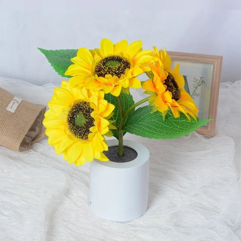 Lampe tournesol led éteinte en pot blanc montrant les détails des fleurs et feuilles jaunes artificielles sur fond blanc