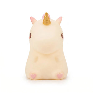 Petite veilleuse licorne en silicone blanc et rose avec une corne dorée, idéale pour la chambre d'enfant.