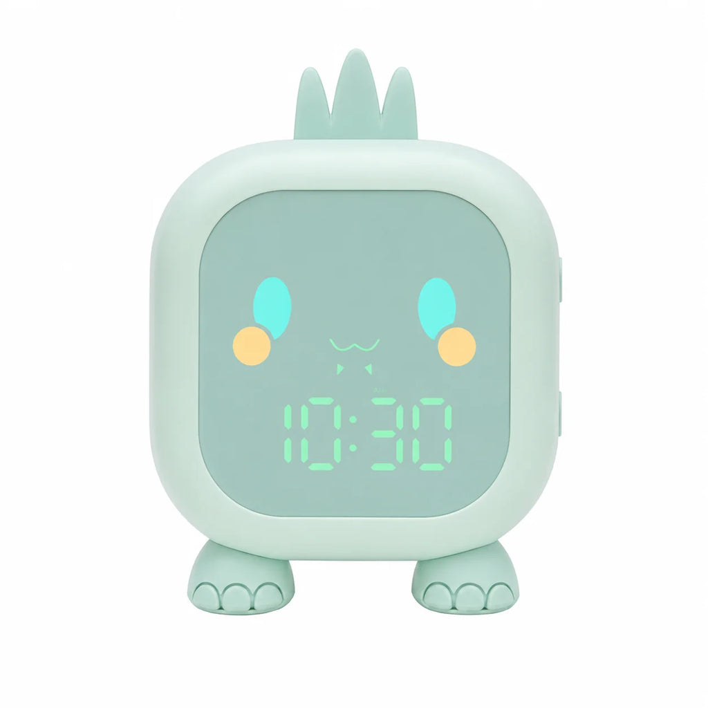 Réveil veilleuse dinosaure de couleur verte vu de face avec son affichage numérique lumineux sur fond blanc.