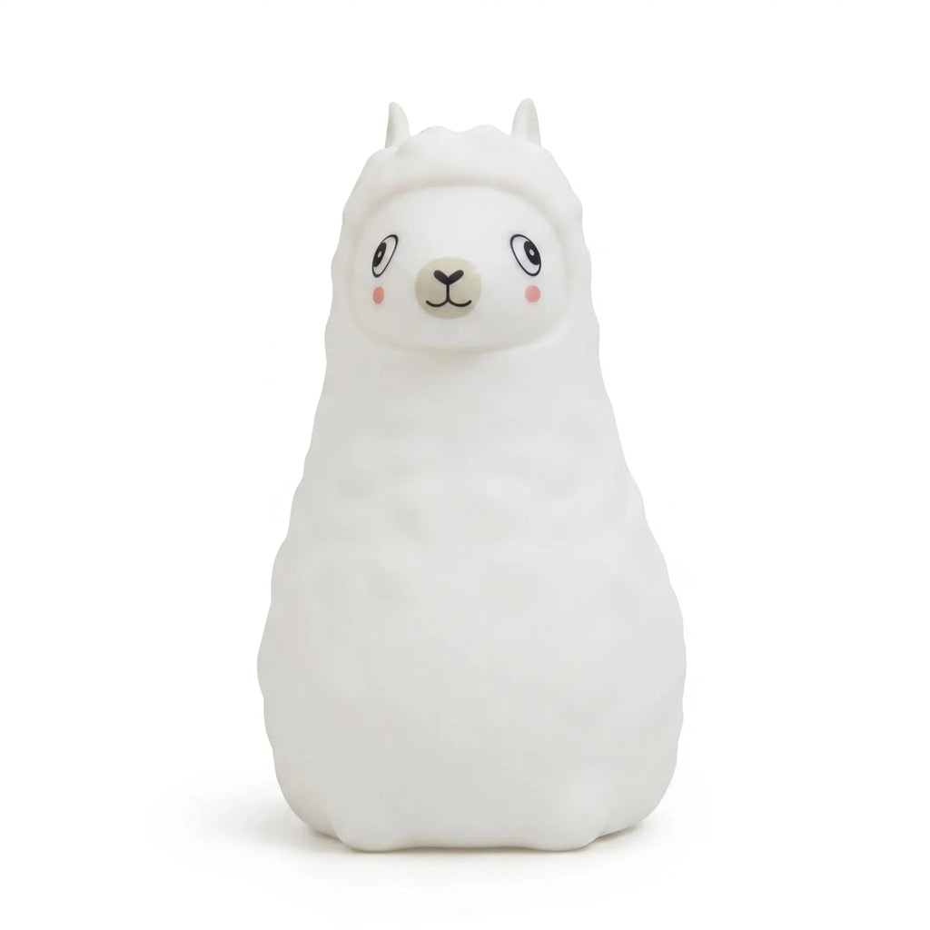 Veilleuse en silicone en forme de petit alpaga blanc sur fond blanc.