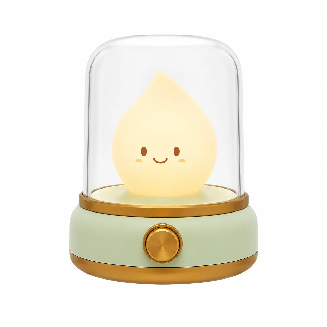 Veilleuse bougie LED en forme de petite flamme souriante sous un dôme transparent avec une base verte et dorée.