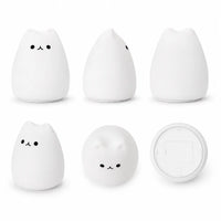 Mosaïque de six visuels présentant une veilleuse chat en silicone blanc éteinte sous différents angles. Le produit au design minimaliste est photographié de face, de profil, de dos, de trois-quarts, du dessus et du dessous pour dévoiler sa base ronde sur un fond blanc uni.