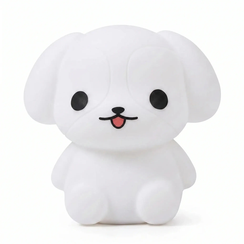 Veilleuse en silicone en forme de petit chiot blanc sur fond blanc.