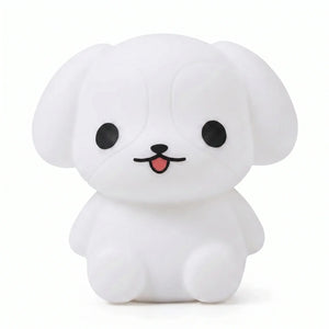 Veilleuse en silicone en forme de petit chiot blanc sur fond blanc.