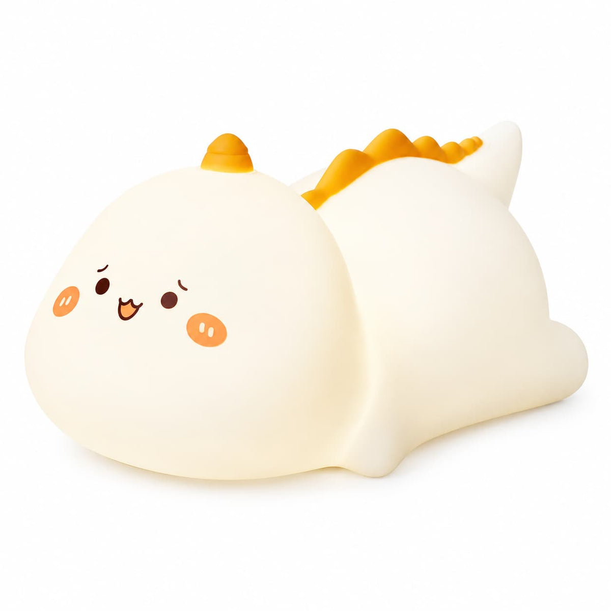 Veilleuse dinosaure tactile en silicone blanc avec de petites crêtes orange sur le dos et un visage mignon illuminé sur fond blanc.