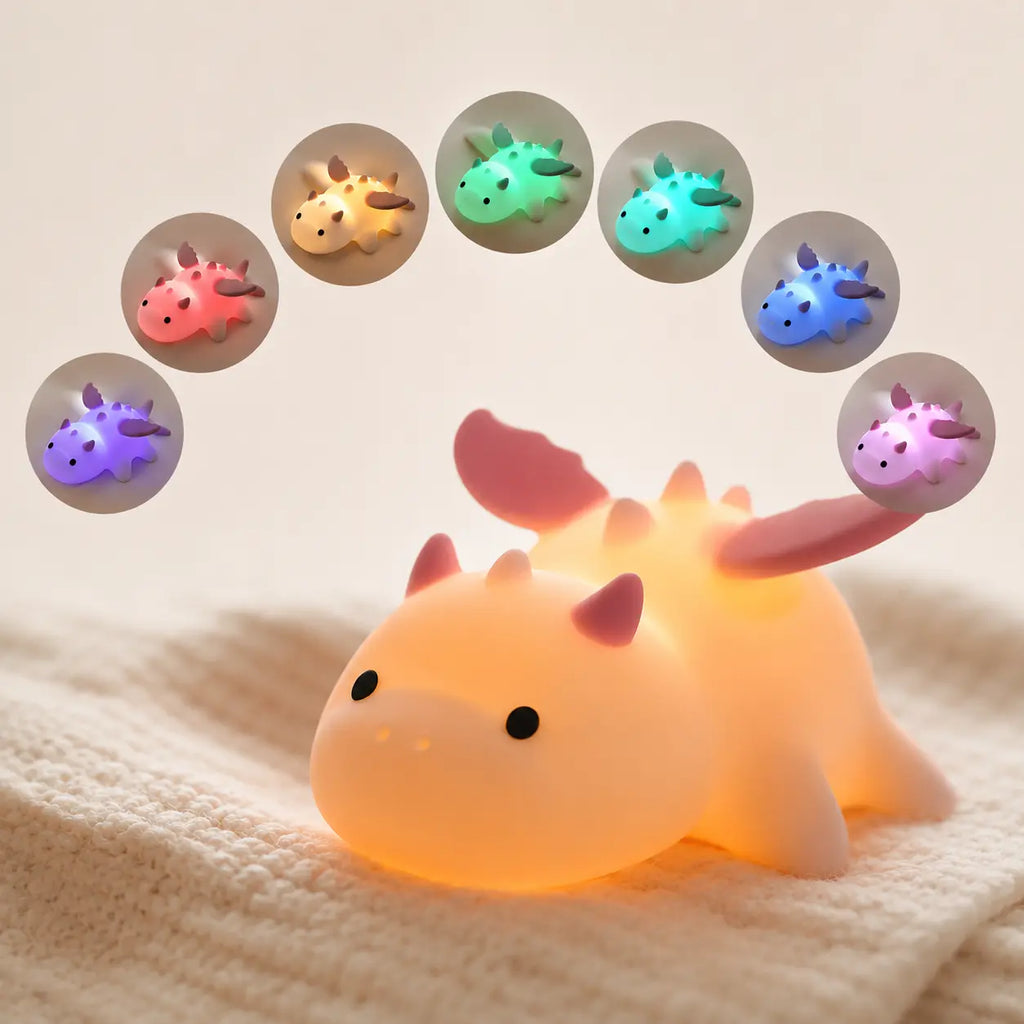 Veilleuse dragon en silicone illuminée affichant en arc de cercle les différentes variations de couleurs LED disponibles