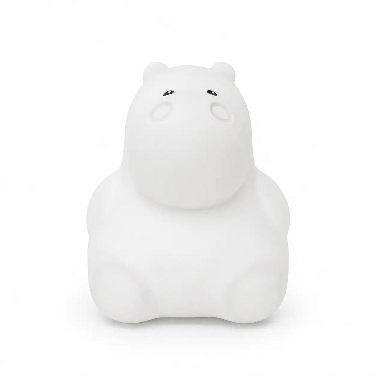 Veilleuse en silicone en forme de petit hippopotame blanc, sur un fond blanc.