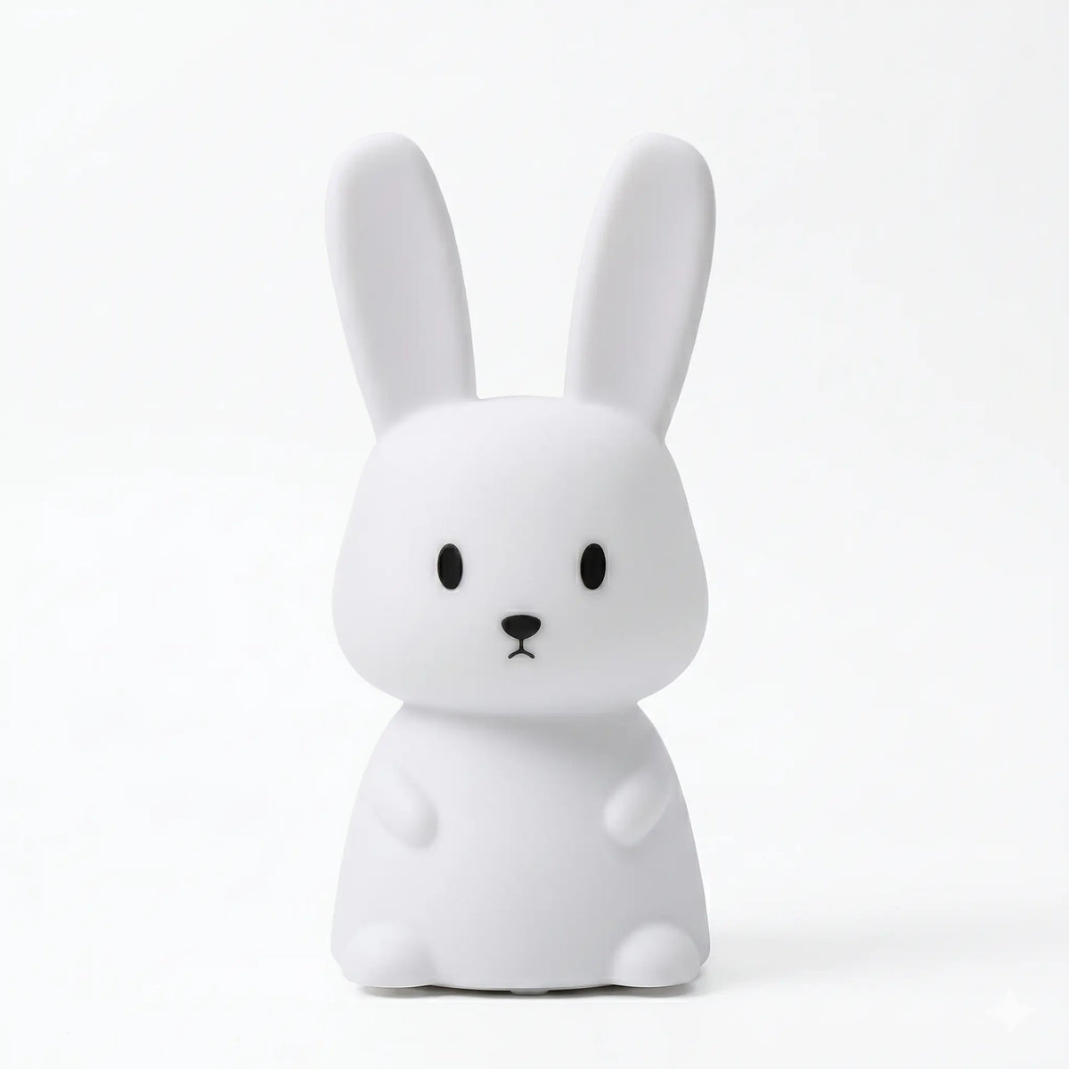 Veilleuse en silicone en forme de lapin blanc aux oreilles dressées, sur un fond blanc.