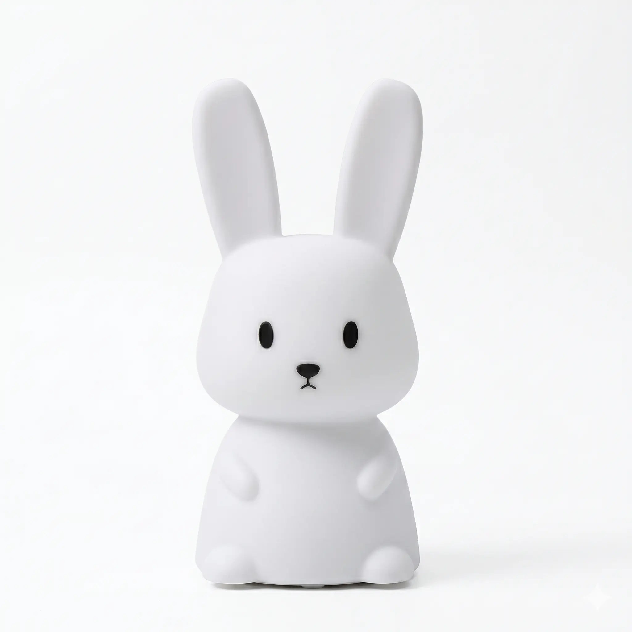 Veilleuse en silicone en forme de lapin blanc aux oreilles dressées, sur un fond blanc.