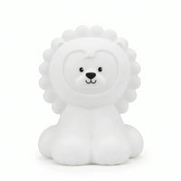 Veilleuse en silicone en forme de petit lion blanc assis, vue de face sur un fond blanc.