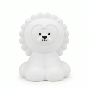 Veilleuse en silicone en forme de petit lion blanc assis, vue de face sur un fond blanc.