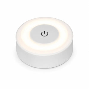 Veilleuse murale tactile ronde blanche avec bouton central d'allumage sur fond blanc