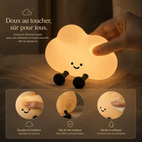 Infographie en français présentant une veilleuse nuage en silicone allumée, tenue par une main. Le visuel comporte le texte "Doux au toucher, sûr pour tous" et trois vignettes explicatives illustrant ses avantages : sa texture souple et moelleuse agréable au toucher, sa conception sûre et non toxique sans BPA ni phtalates, et sa facilité de nettoyage avec un chiffon sur sa surface lisse.