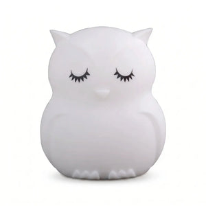 Veilleuse en silicone en forme de chouette blanche aux yeux clos sur fond blanc.