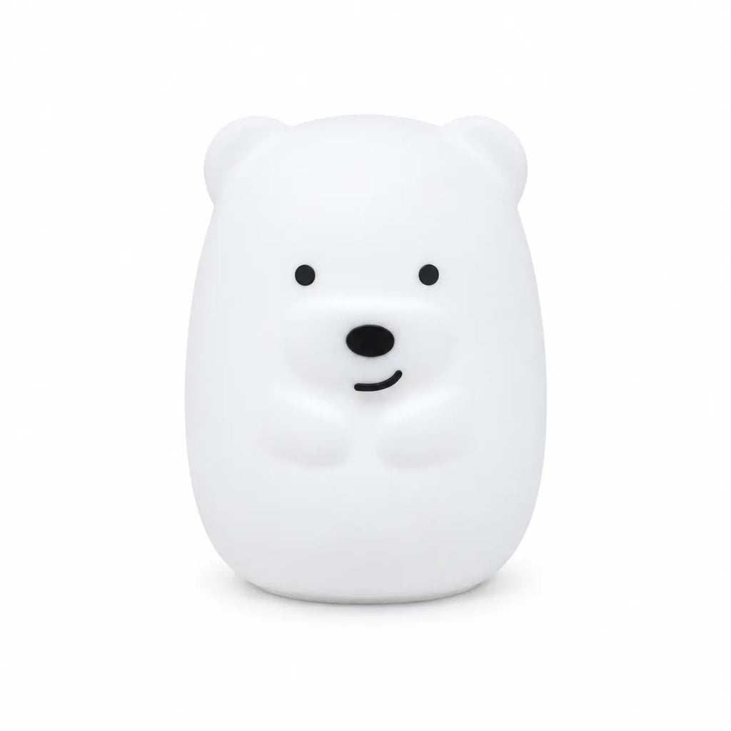 Veilleuse en silicone en forme de petit ours blanc, sur un fond blanc.