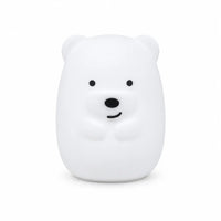 Veilleuse en silicone en forme de petit ours blanc, sur un fond blanc.
