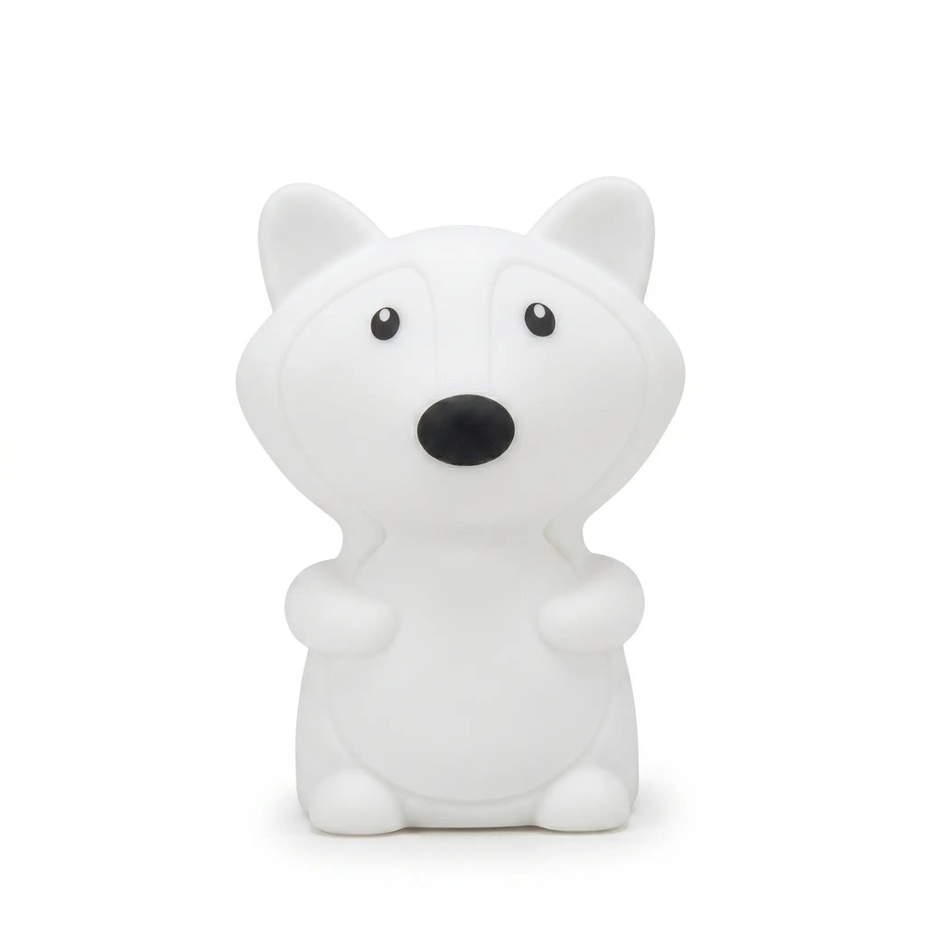 Veilleuse en silicone en forme de petit renard blanc, sur un fond blanc.