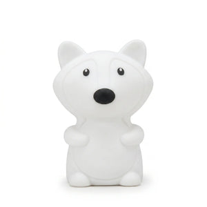 Veilleuse en silicone en forme de petit renard blanc, sur un fond blanc.