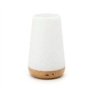 Veilleuse scandinave éteinte avec sa partie supérieure blanche et sa base effet bois clair, présentée de face sur fond blanc.