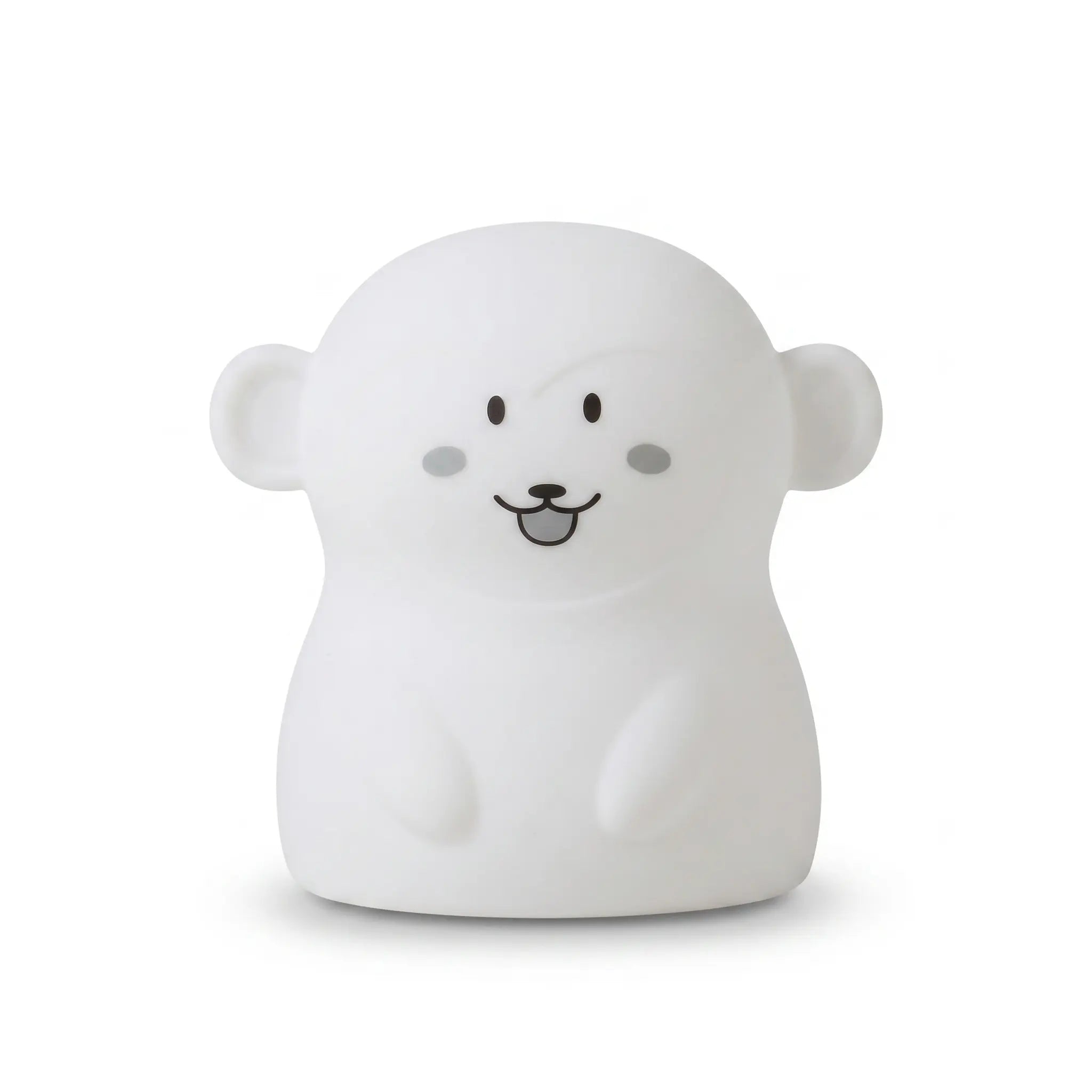 Veilleuse en silicone en forme de petit singe blanc, sur un fond blanc.